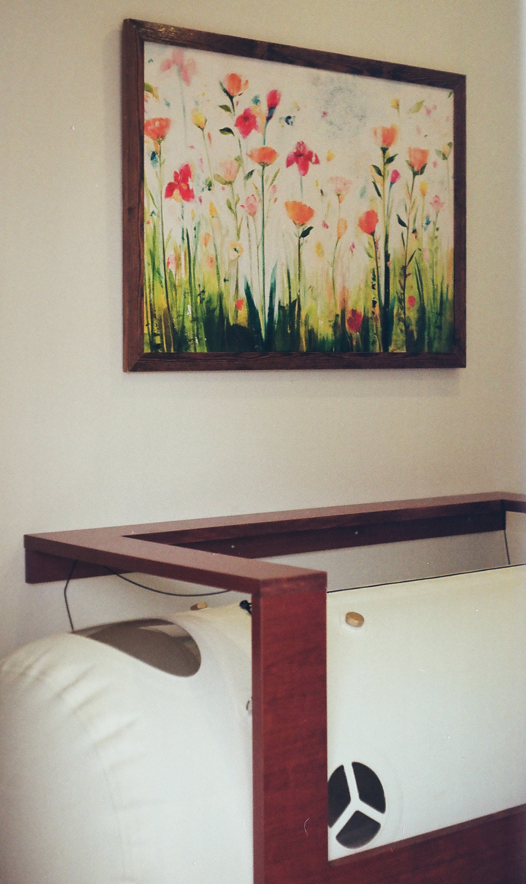 The chamber beneath a colourful floral painting in the calm relaxation room.